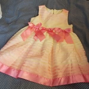 Fun pink and yellow dress with bows